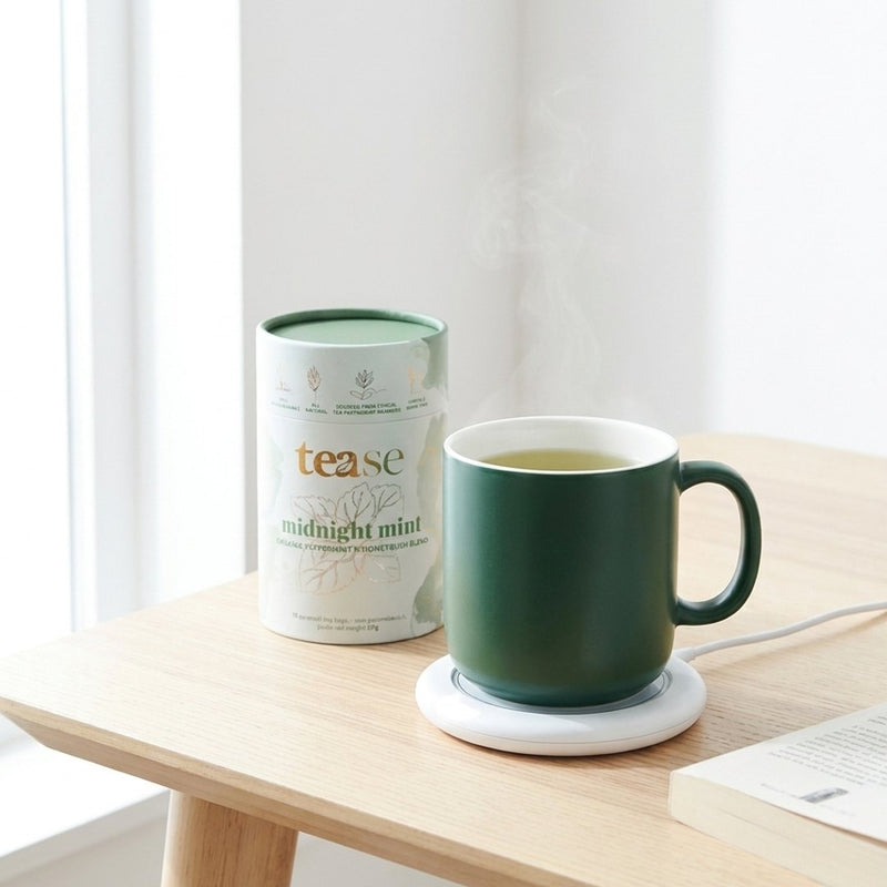 The Smart Heated Tea Mug on its warming coaster