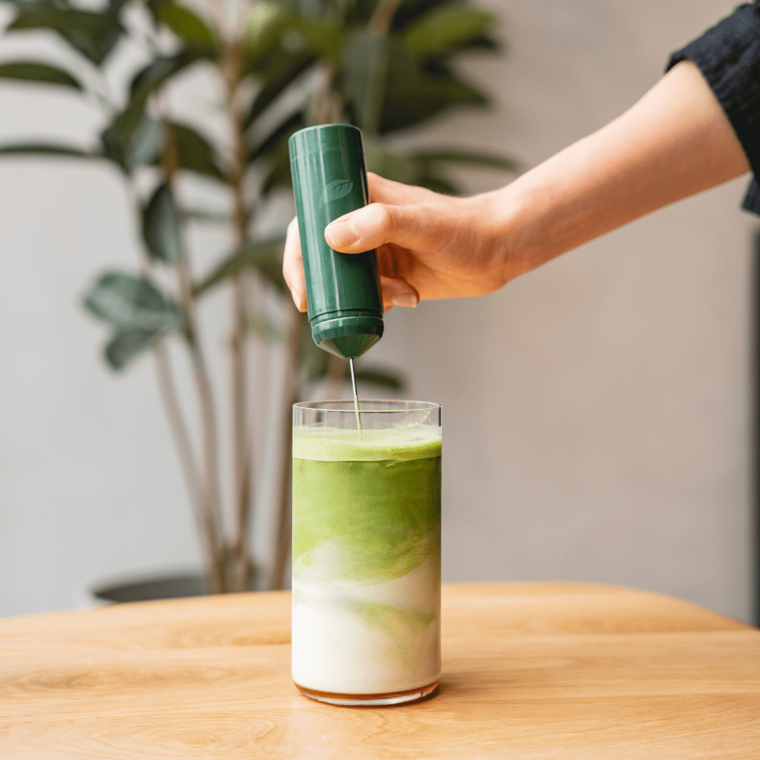 Tease Tea matcha being poured into a layered matcha latte
