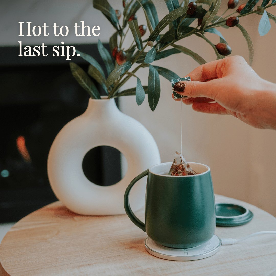 The heated mug steaming on its coaster beside a Midnight Mint tube